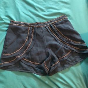 Blue flowy shorts with gold detail